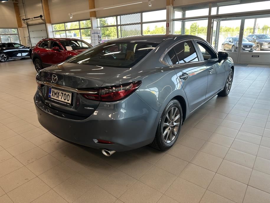 Sedan 2,0 (165) SKYACTIV-G Vision Business 6AT 4ov YQ1B